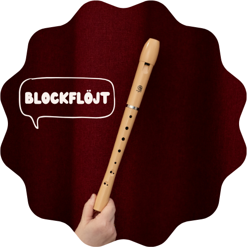 Bild på en blockflöjt mot ett vinrött skynke